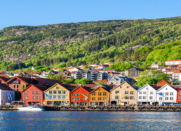 Coast of Norway lined with colorful houses.