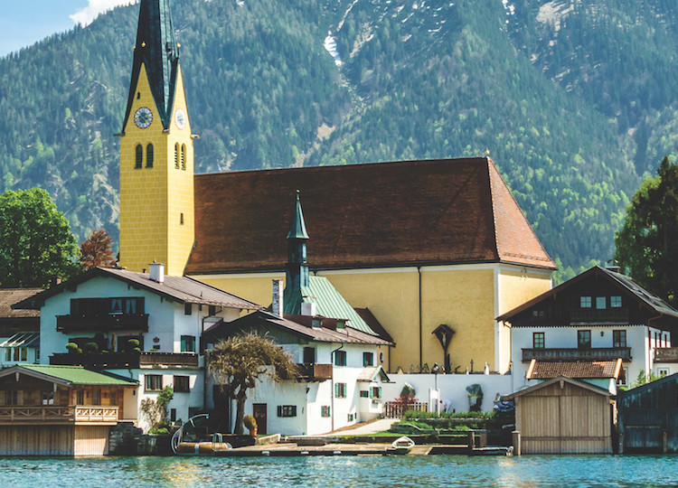 A view of an Austria village with a church standing prominently in the centre.