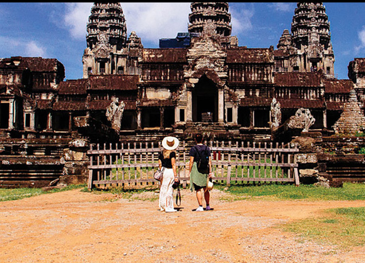 Two Topdeck travelers at an ancient Cambodian ruin.