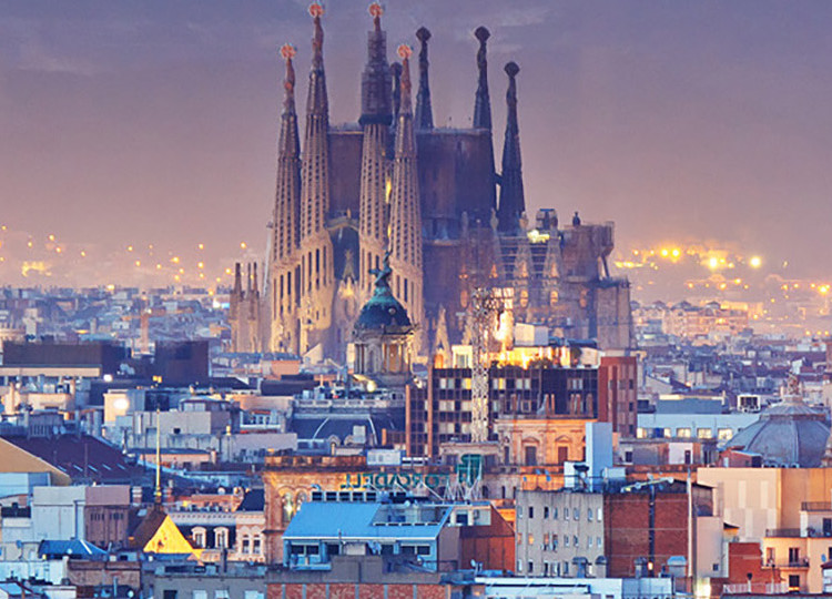 A view of Barcelona, with the Sagrada Família Cathedral dominating the background.