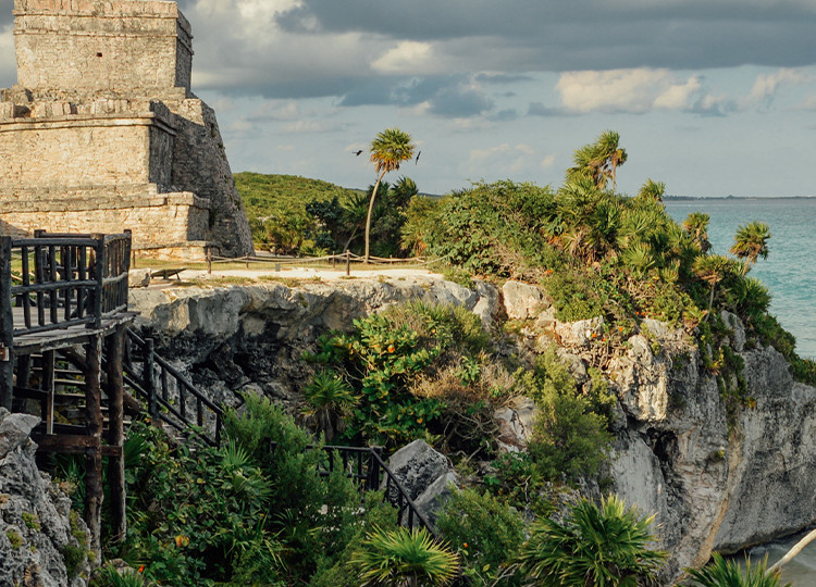 The ancient ruins of Tulum standing vigil over the Mexico shoreline.