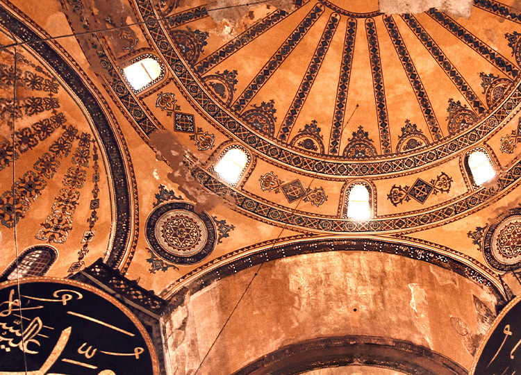 A view of one of the grand domed ceilings of the Hagia Sophia, one of the world's most iconic religious sites located in Istanbul.